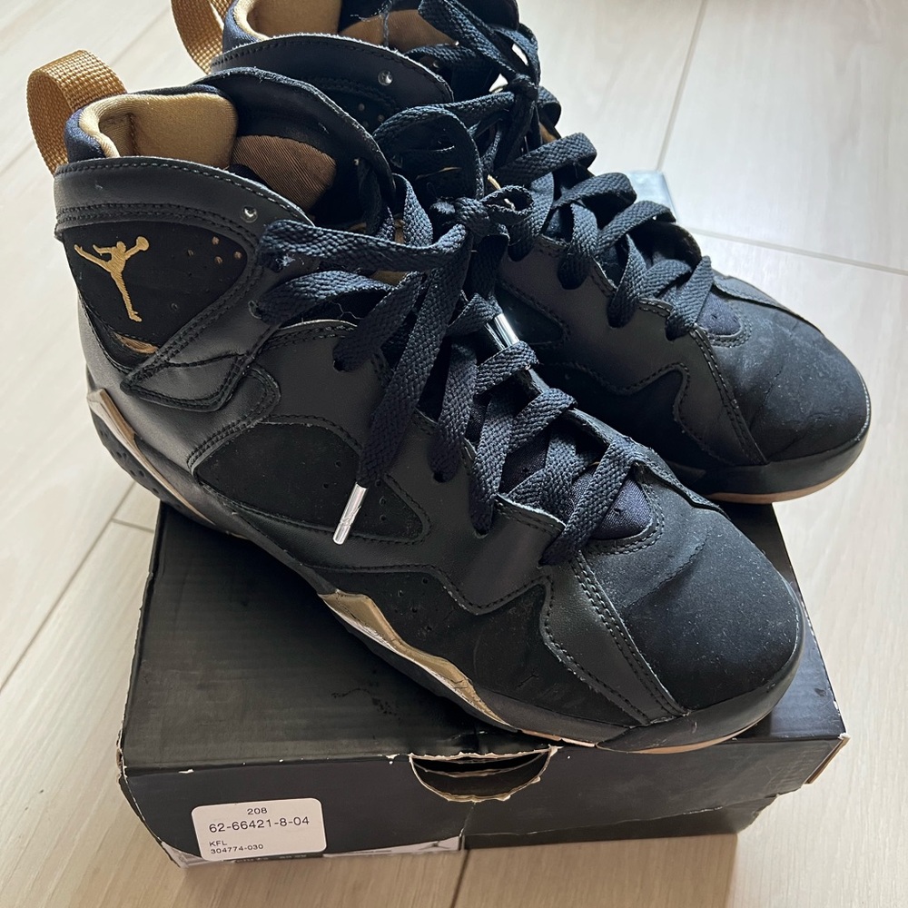 Jordan Black and Gold High-Top Sneakers